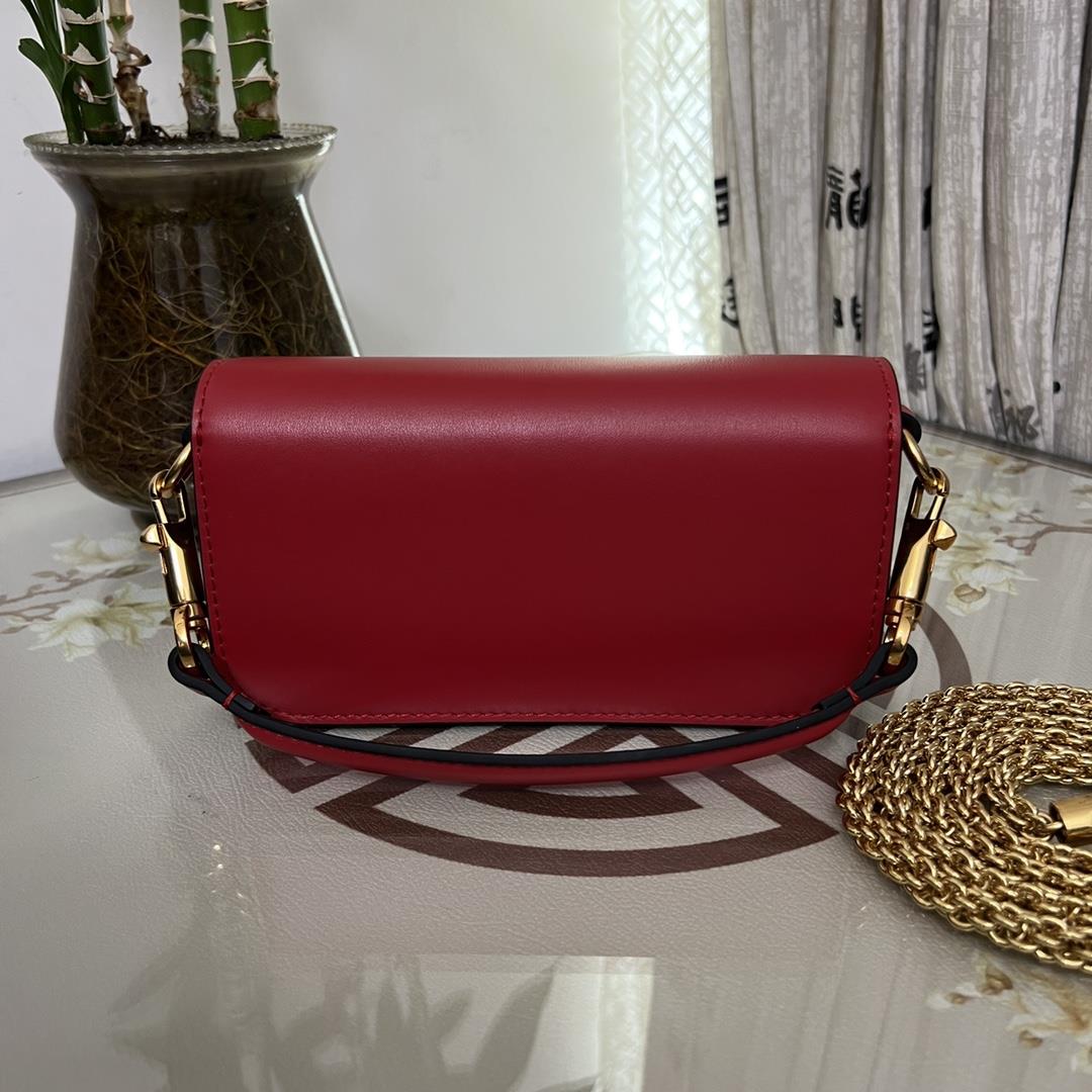 Small Garavani MINI LOC calfskin handbag with metal VLogo Signature detailsEquipped with detac