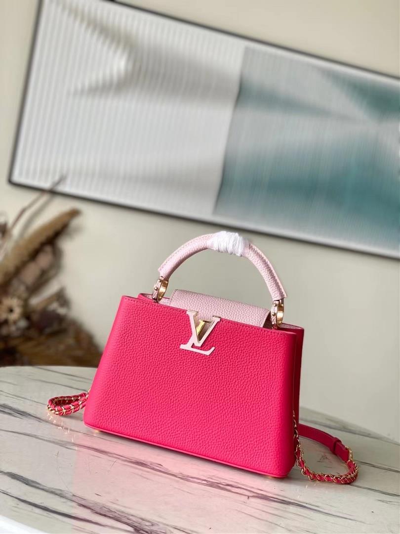 The toplevel original M21689 pink small size Taurilon leather version of the Capuchines BB handbag