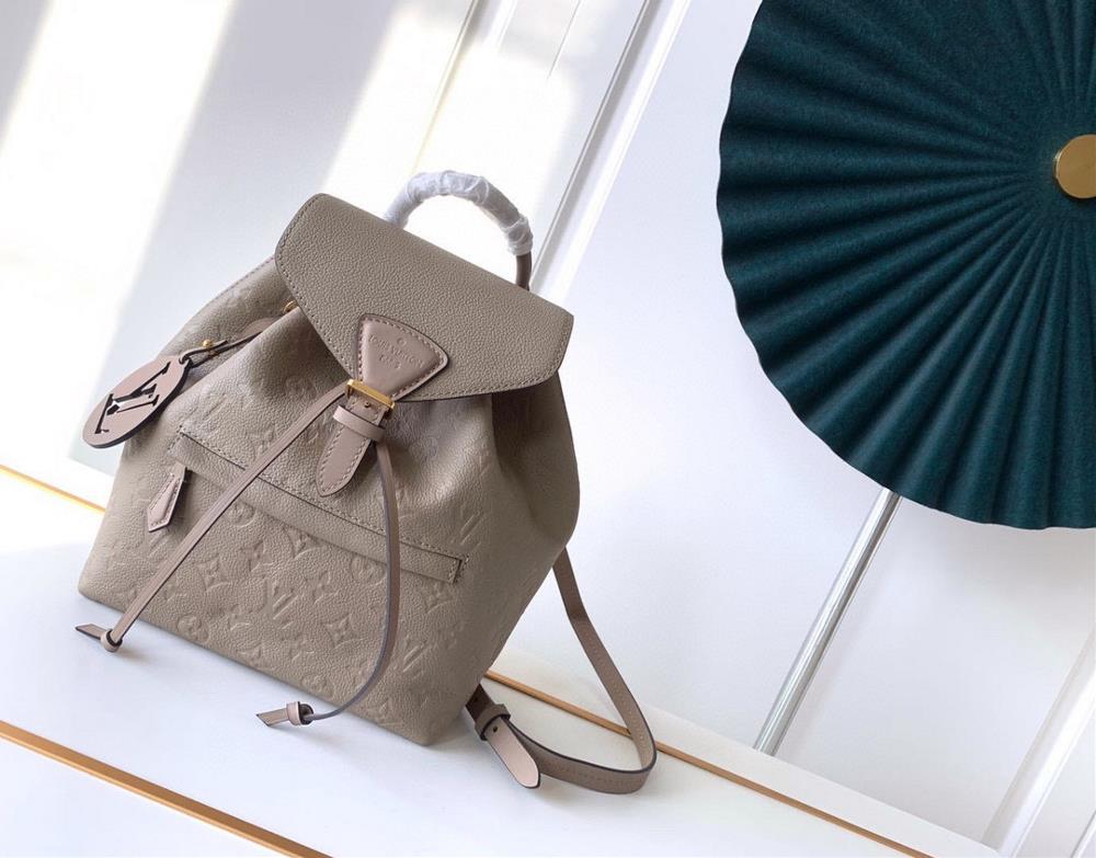 The M45205 gray Montsouris backpack which was introduced in 1994 features Monogram Imprente embossed leather accented with vintage metal buckles and