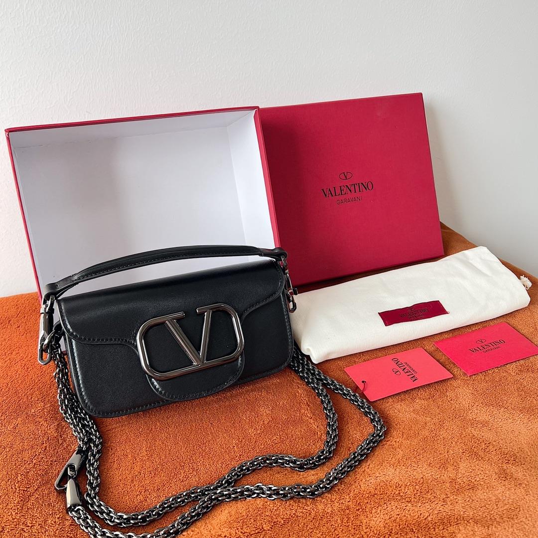 Garavani MINI LOC calfskin handbag with metal VLogo Signature detailsEquipped with detachable handle