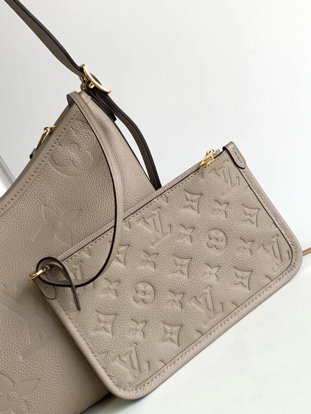 M46288 M46203 matching details CarryAll small size handbag is made of Monogram Imprente emboss