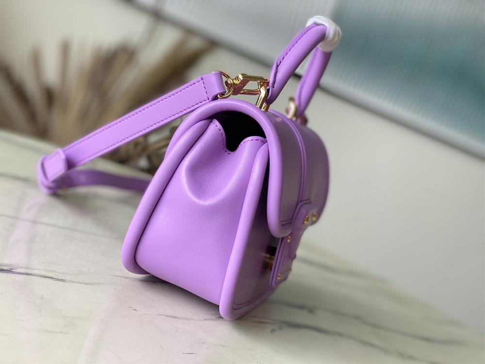 M22721 Taro PurpleThis Hide Seek handbag features Epi leather accents in bright tones fea