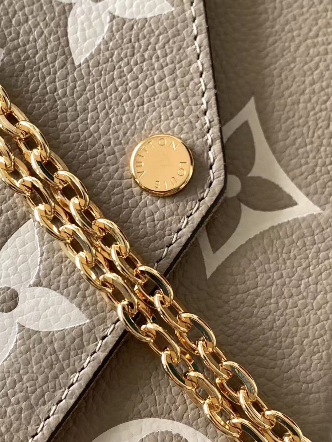 M61276 M64064 M64065 This Pochette F  licie chain bag features Monogram Imprente leather depic