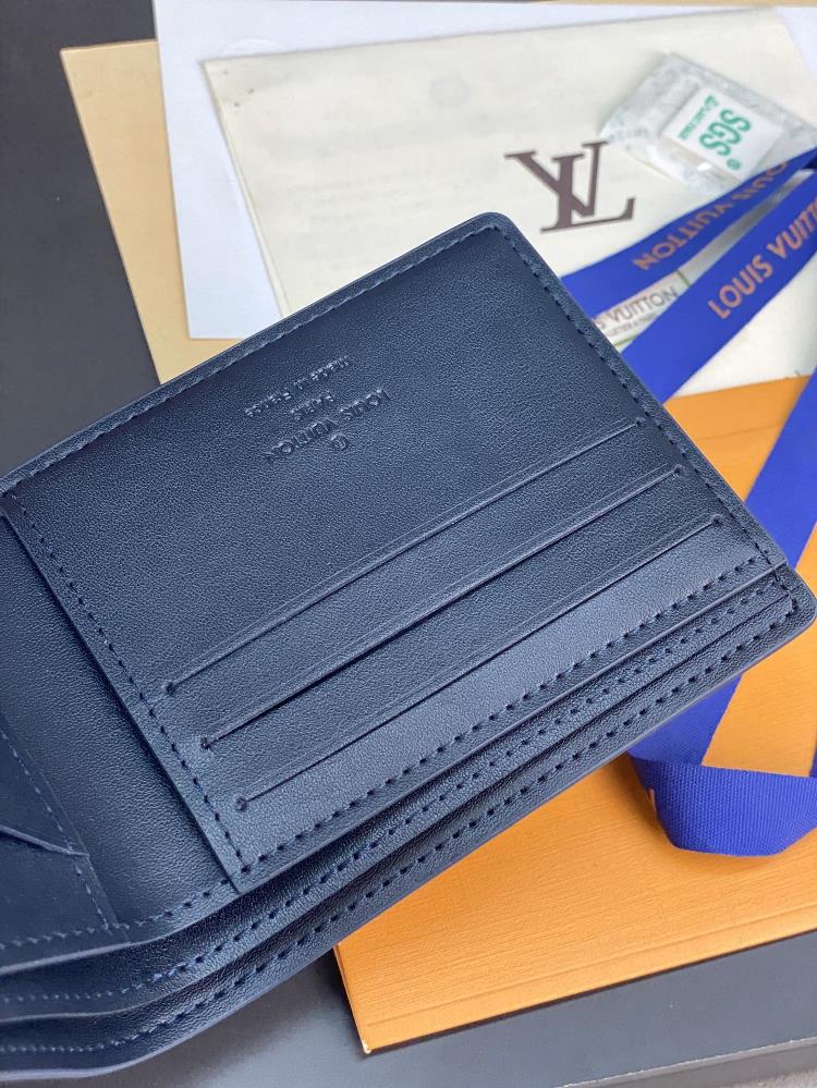 M82323 Blue This Multiples Wallet Uses Smooth Cowhide And Reproduces The Monography Pat