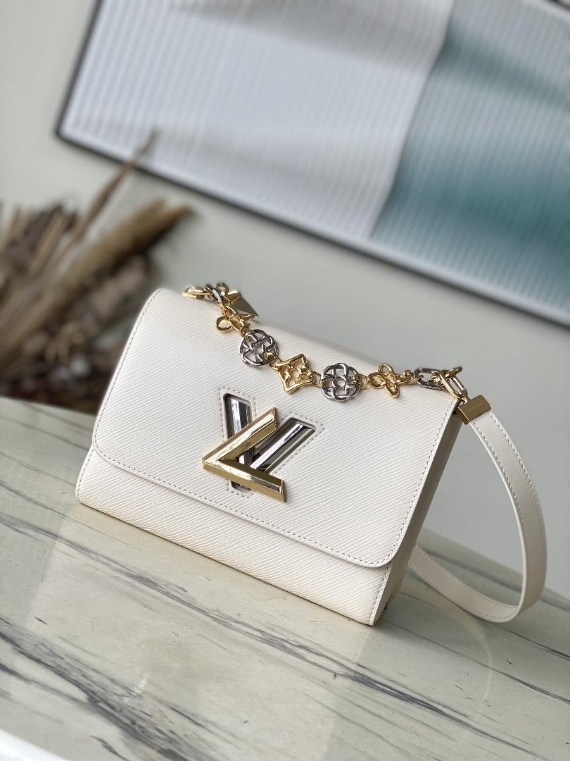 M22774 meter whiteThis Twist Medium handbag incorporates the brands iconic Monogram flowers into th