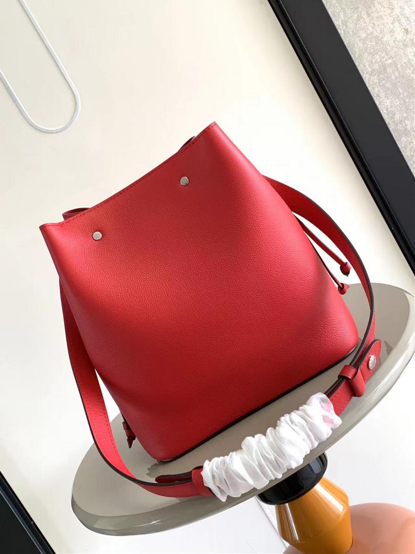 M54677s latest water bucket bag features imported soft calf leather with a shiny twist lo