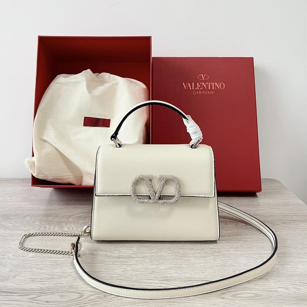 Mini Valentino Garavani VSLINGPaired with an extendable color matching shoulder strap and handle it allows for easy switching between shoulders cros