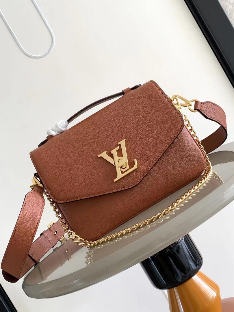 lv Oxford handbag is made of soft grain leather and showcases the brands style with dazzling metal