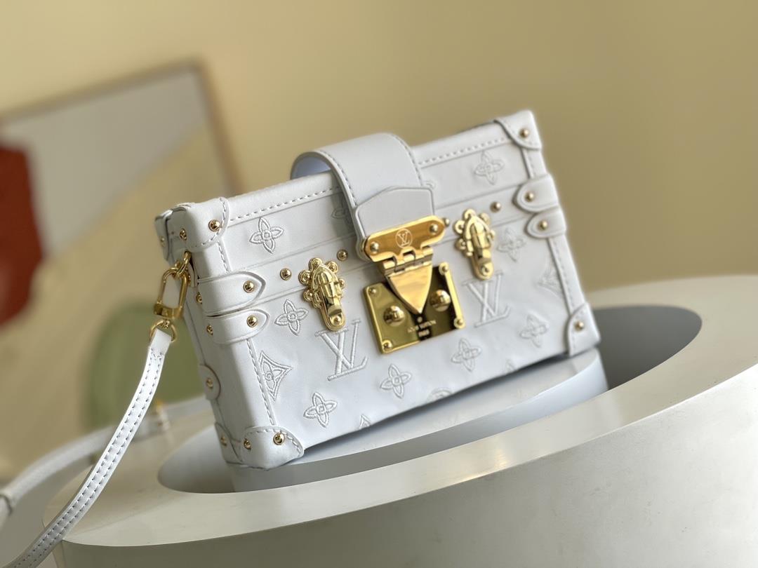 The toplevel original M20847 white Petite Malle handbag is made of cow leather and features a 