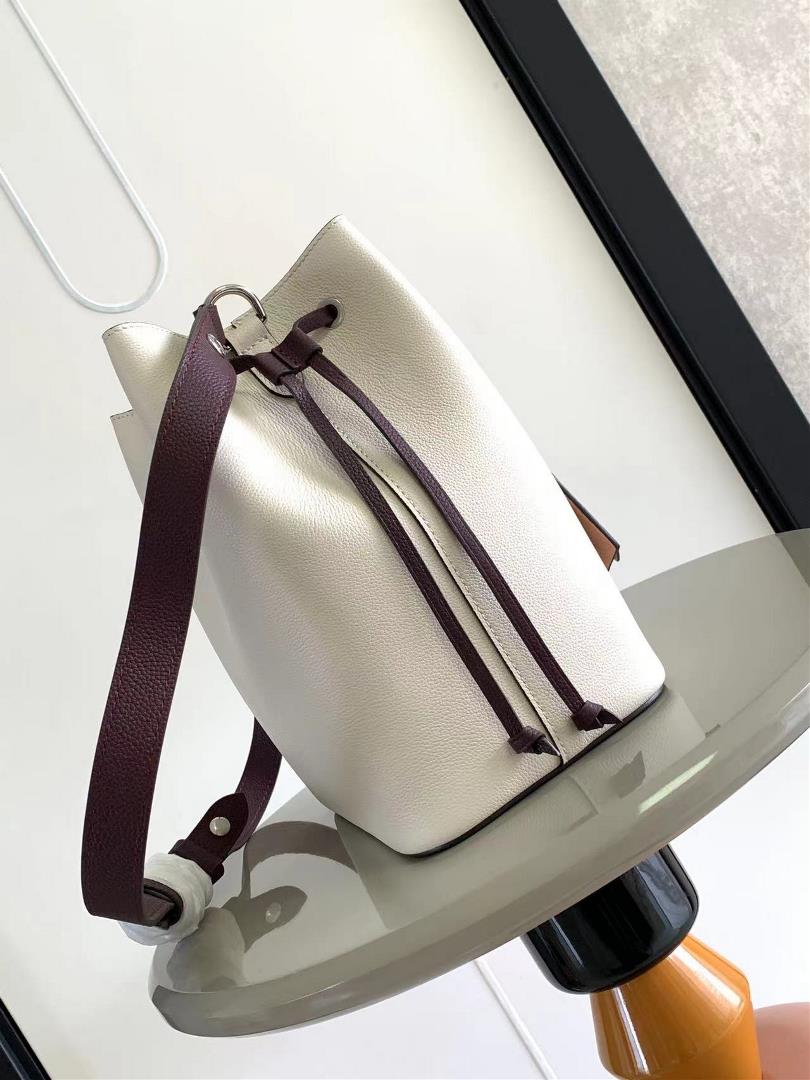 M54677s latest water bucket bag features imported soft calf leather with a shiny twist lo