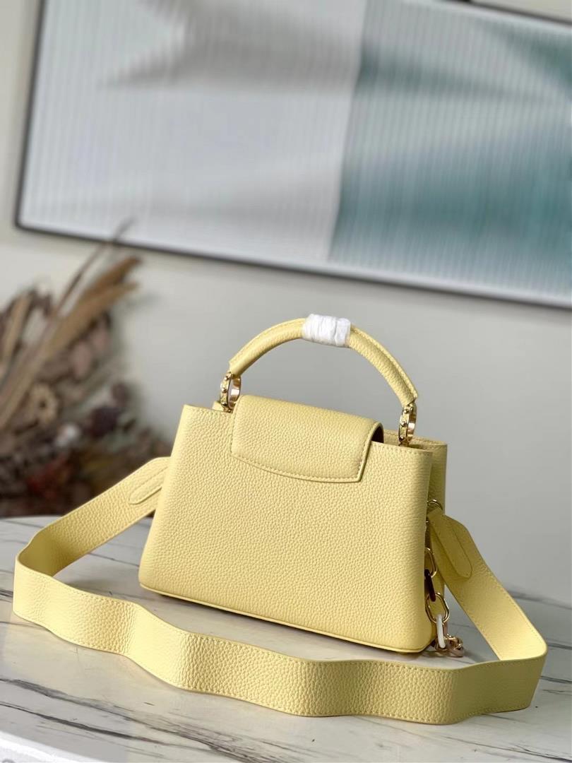 Top of the line original M21798 yellow small size This Capuchines small size handbag is made o