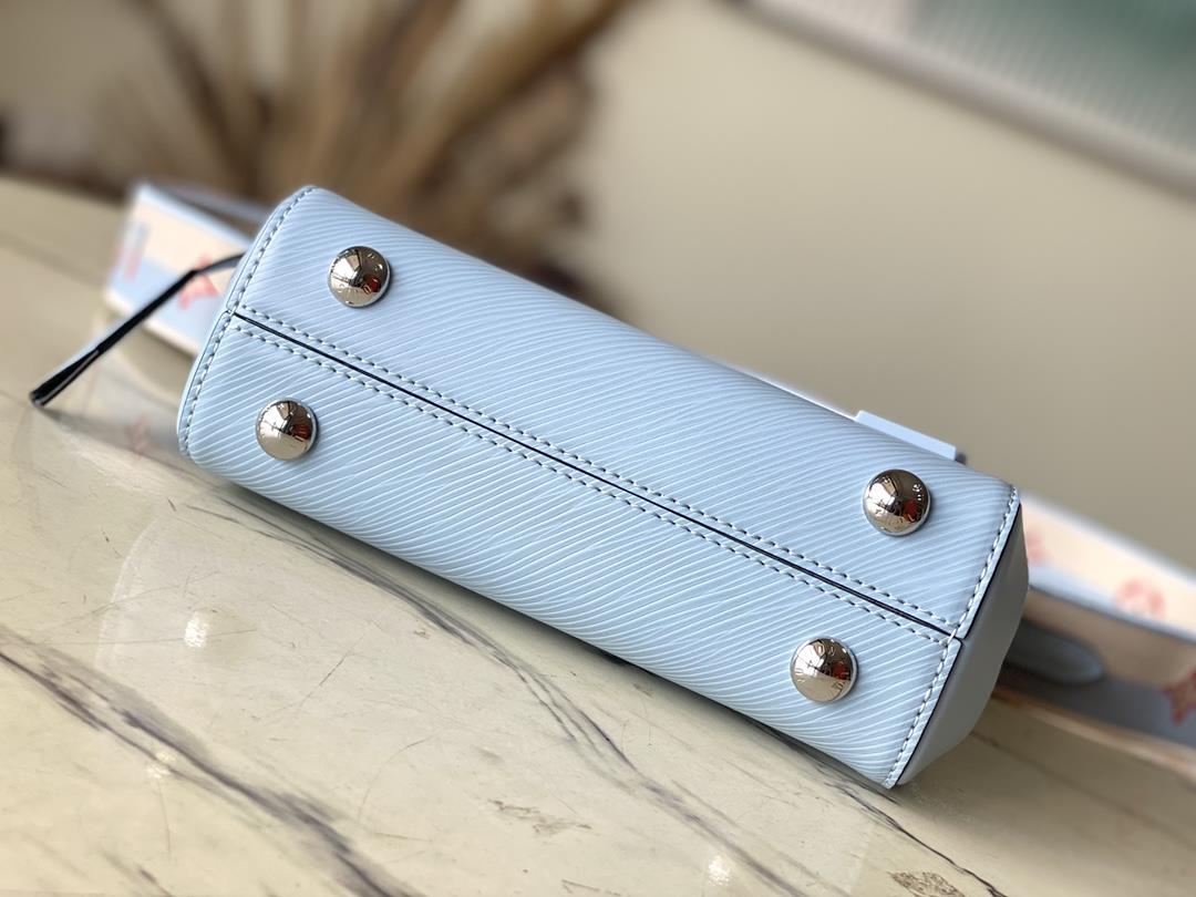 M22617 58931 Sky Blue This Cluny mini handbag conveys a fresh summer style with the unique