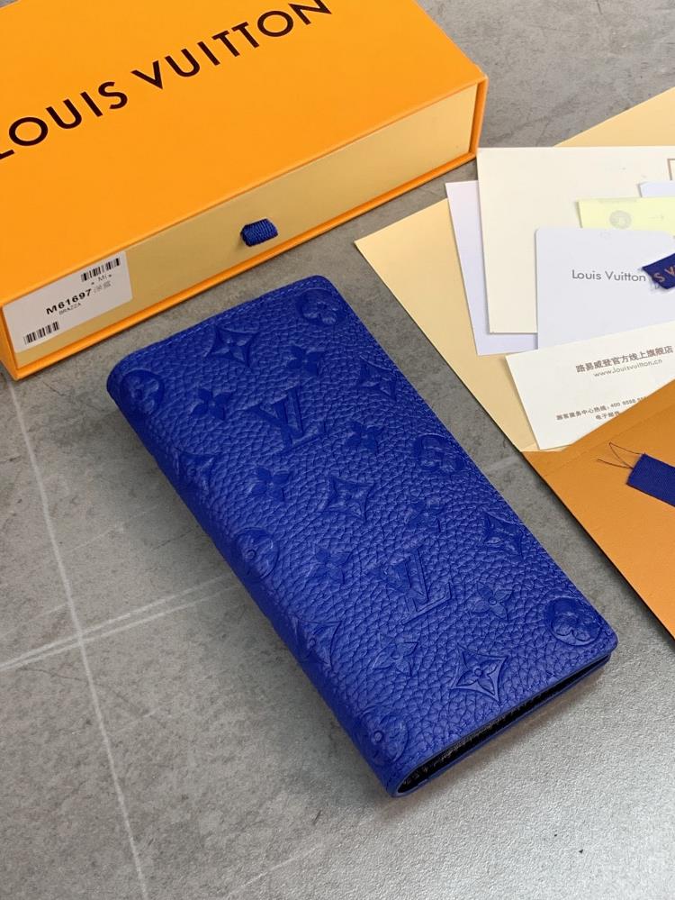 The M61697 Deep Blue Brazza wallet features a soft Taurillon leather embossed Monogram pattern featuring various card slots pockets and large zippe