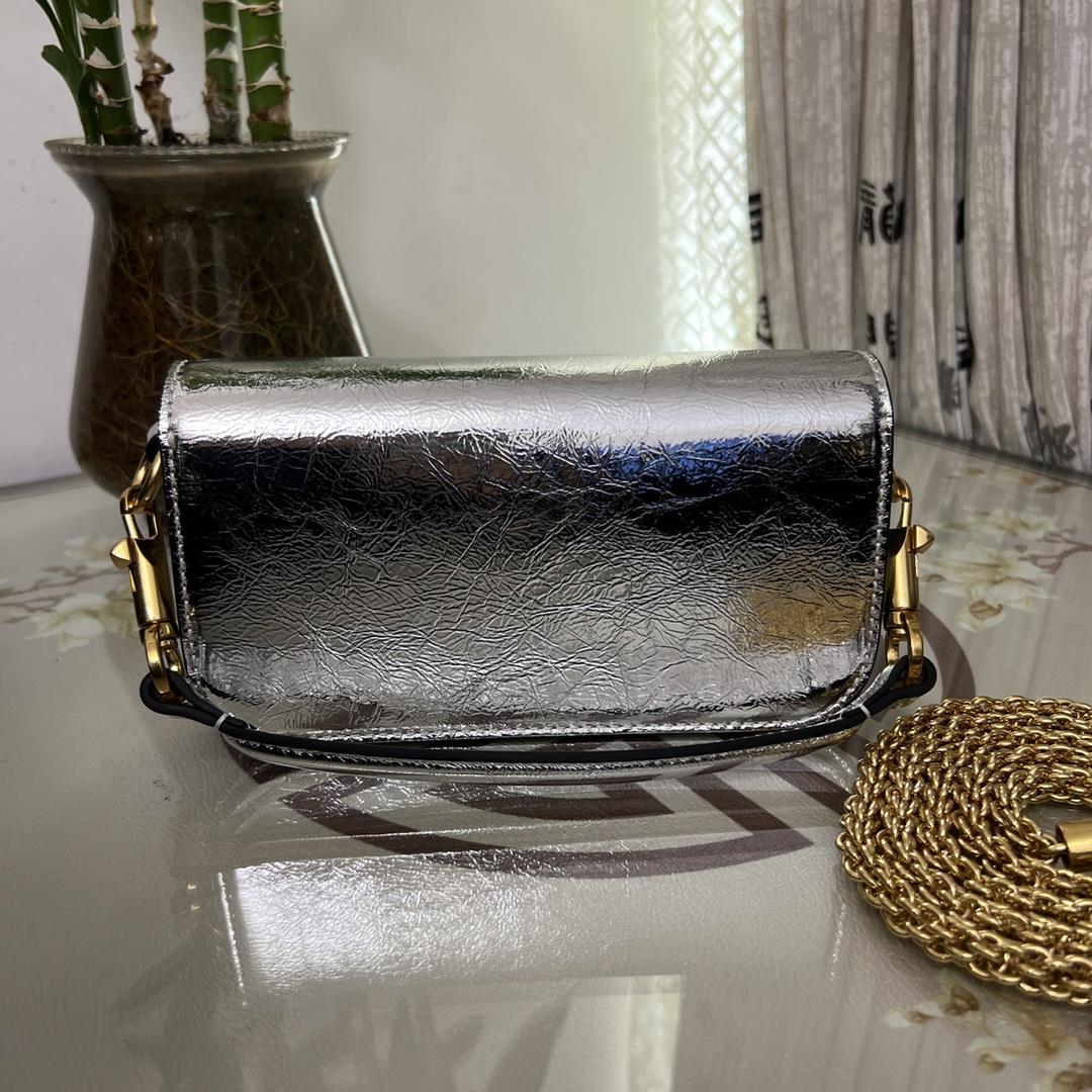 Small Garavani MINI LOC calfskin handbag with metal VLogo Signature detailsEquipped with detac