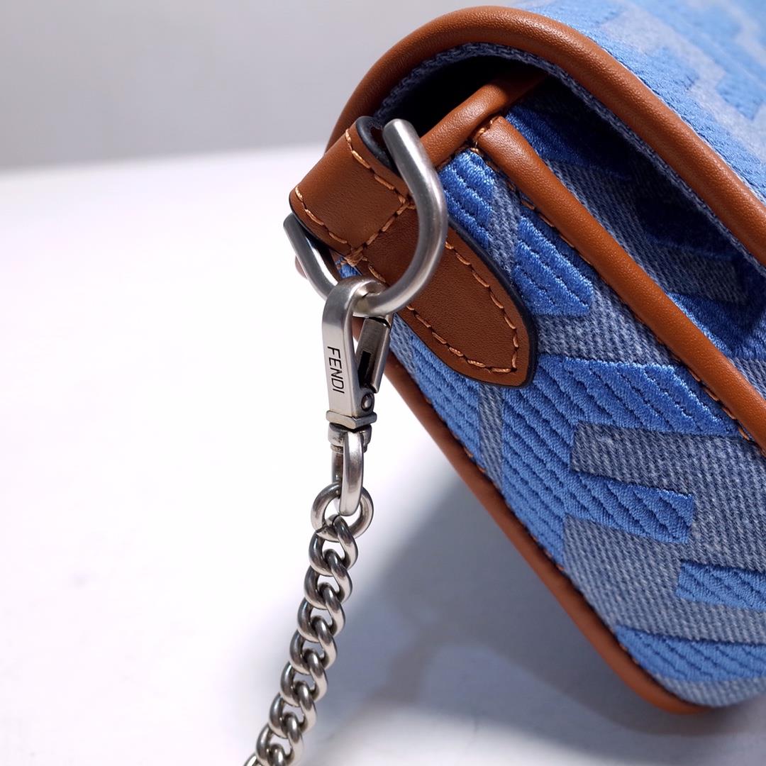 signature Baguette mini handbag made of Baby blue Denim decorated with the same color em