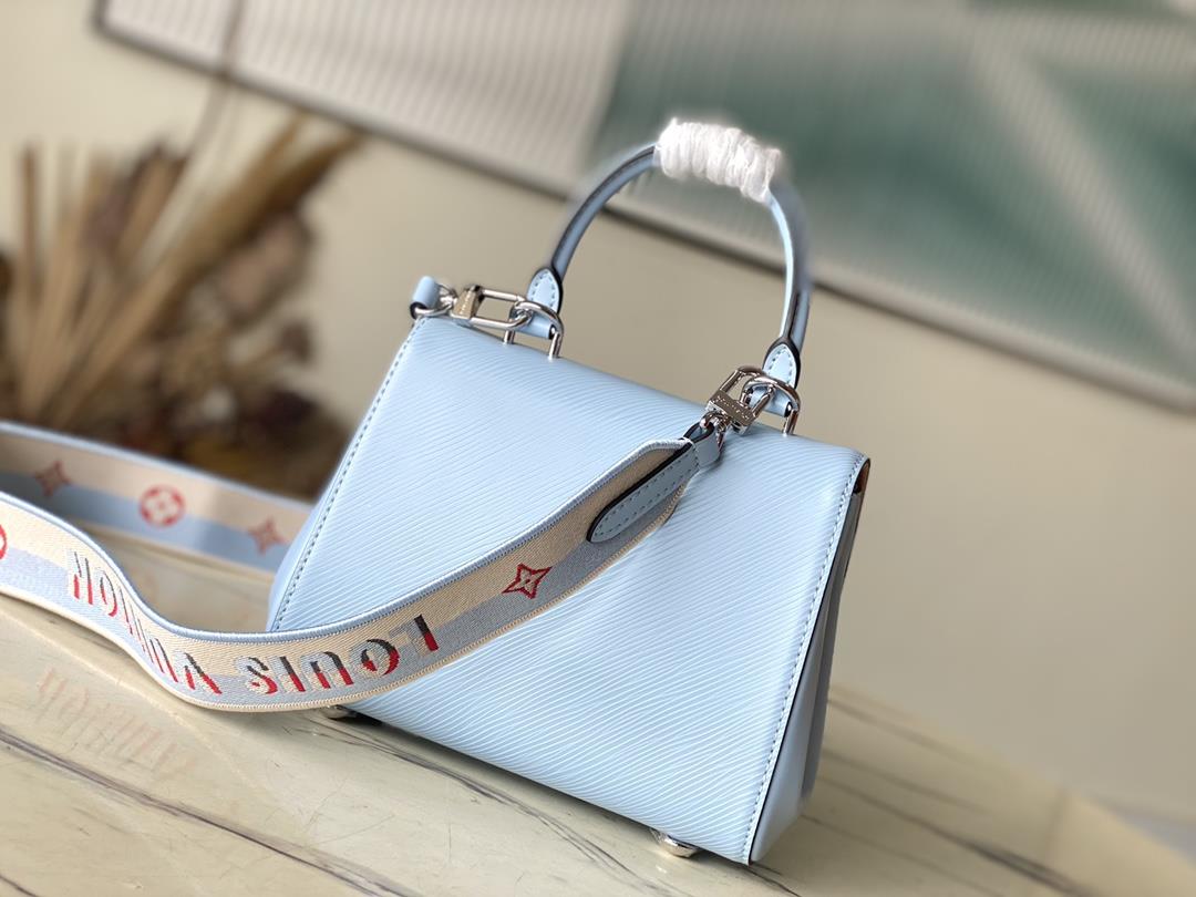 M22617 58931 Sky Blue This Cluny mini handbag conveys a fresh summer style with the unique