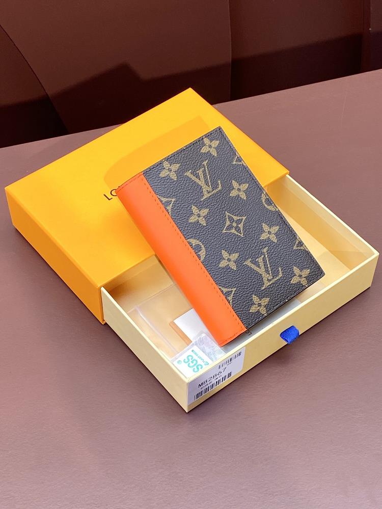 M82867 orange passport case this passport case is made of Monogram Macassar canvas with bright leather trim and the fabric lining continues the same