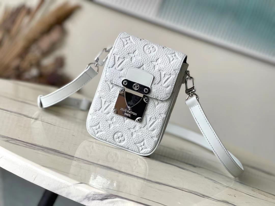 The M82568 Grey SLock Vertical Mini Handbag features an iconic SLock lock inspired by George Vuitto