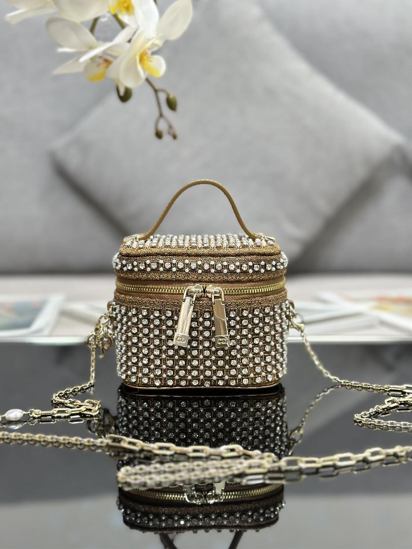 The ultra mini makeup bag Lady Dior Vanity features an embroidered starry white diamond handbag wi