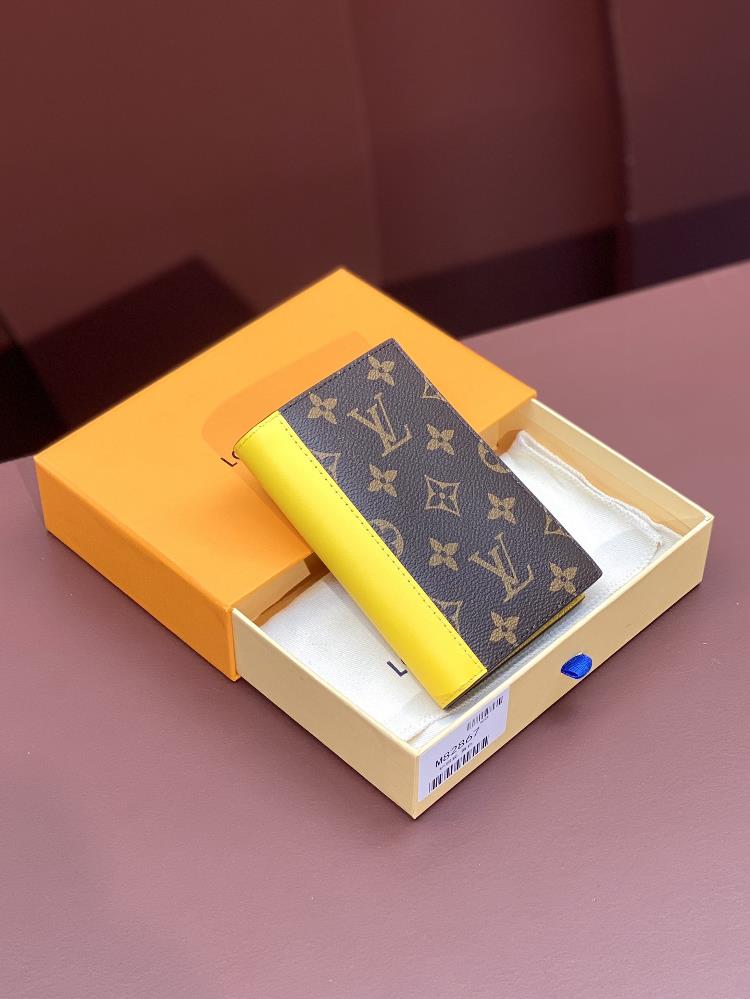 M82867 yellow passport case this passport case is made of Monogram Macassar canvas with bright leather trim and the fabric lining continues the same