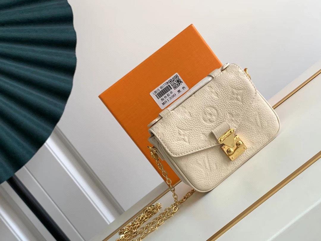 M81389 81390 This Micro Mtis chain bag is made of soft Monogram Imprente leather and features a comp