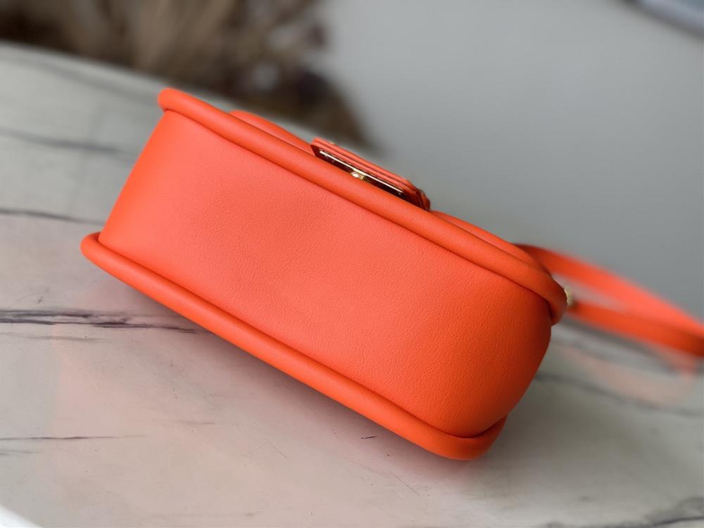 M22723 Orange This Hide Seek handbag features Epi leather accents in bright tones featuri