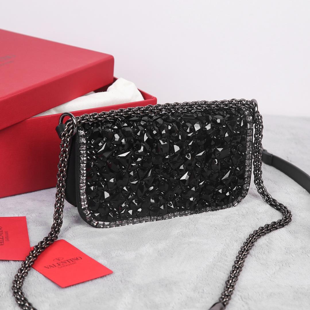 Crystal style The Valentino Garavani Mini Loc handbag is adorned with crystals and Vlogo S