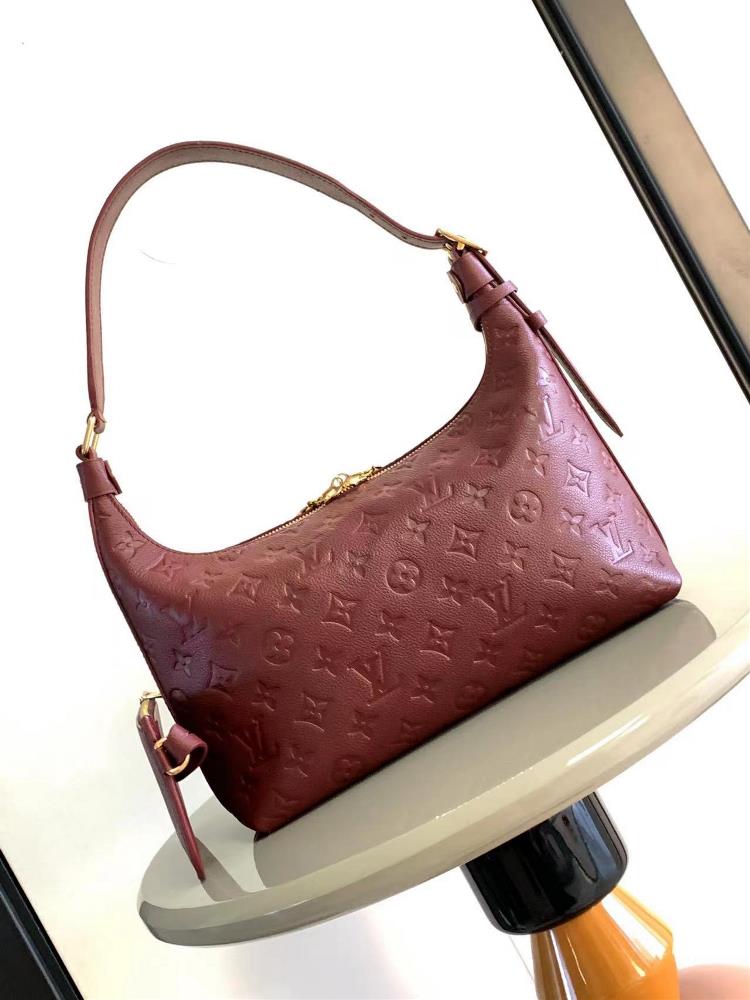 M46610 46609 The Sac Sport handbag is made of soft Monogram Imprente embossed leather with