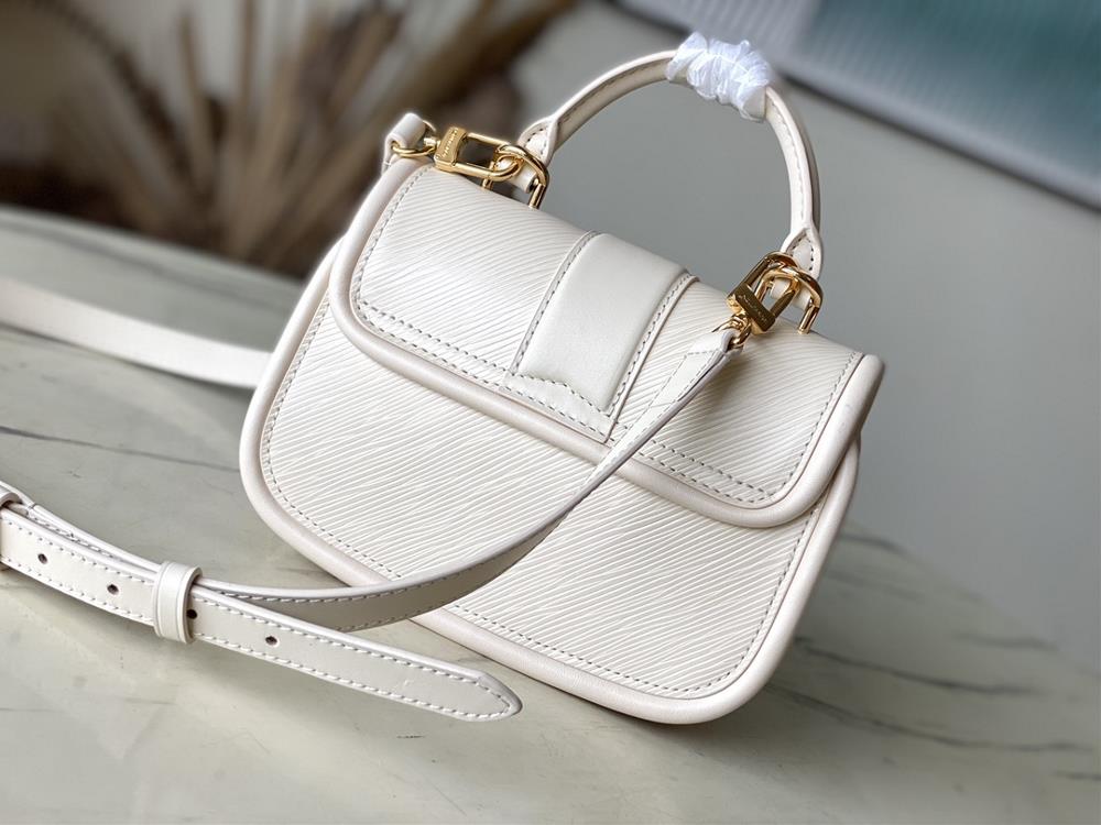 M22720 off whiteThis Hide Seek handbag features Epi leather accents in bright tones featu