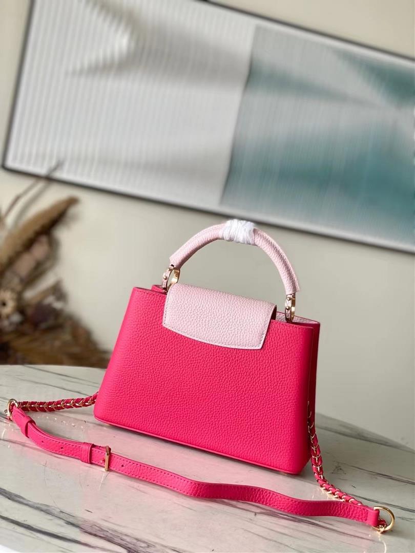 The toplevel original M21689 pink small size Taurilon leather version of the Capuchines BB han