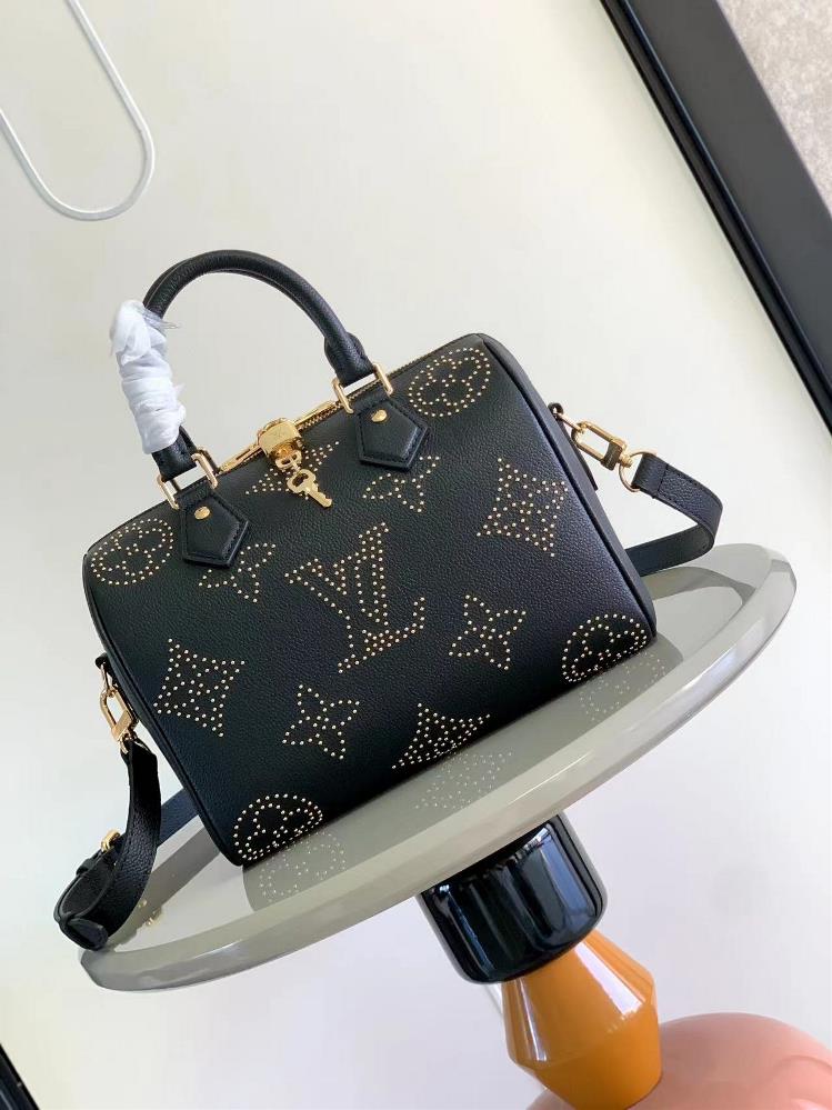 M58951 g studded M46736 This Speedy Bandoulire 25 handbag features a special edition Monogram pattern with gold studs adding a rock aesthetic to the