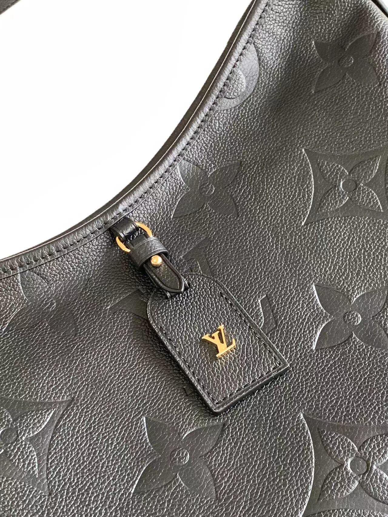 M46289 matching details CarryAll medium size handbag is made of Monogram Imprente embossed lea