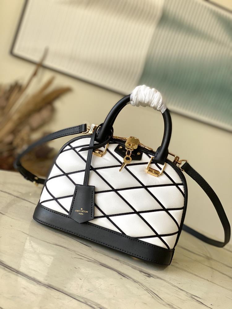 M23666 white M23761 whiteNicolas Ghesquires iconic Alma BB handbag is accented with sheep leather lining creating subtle shadow effects and baking e