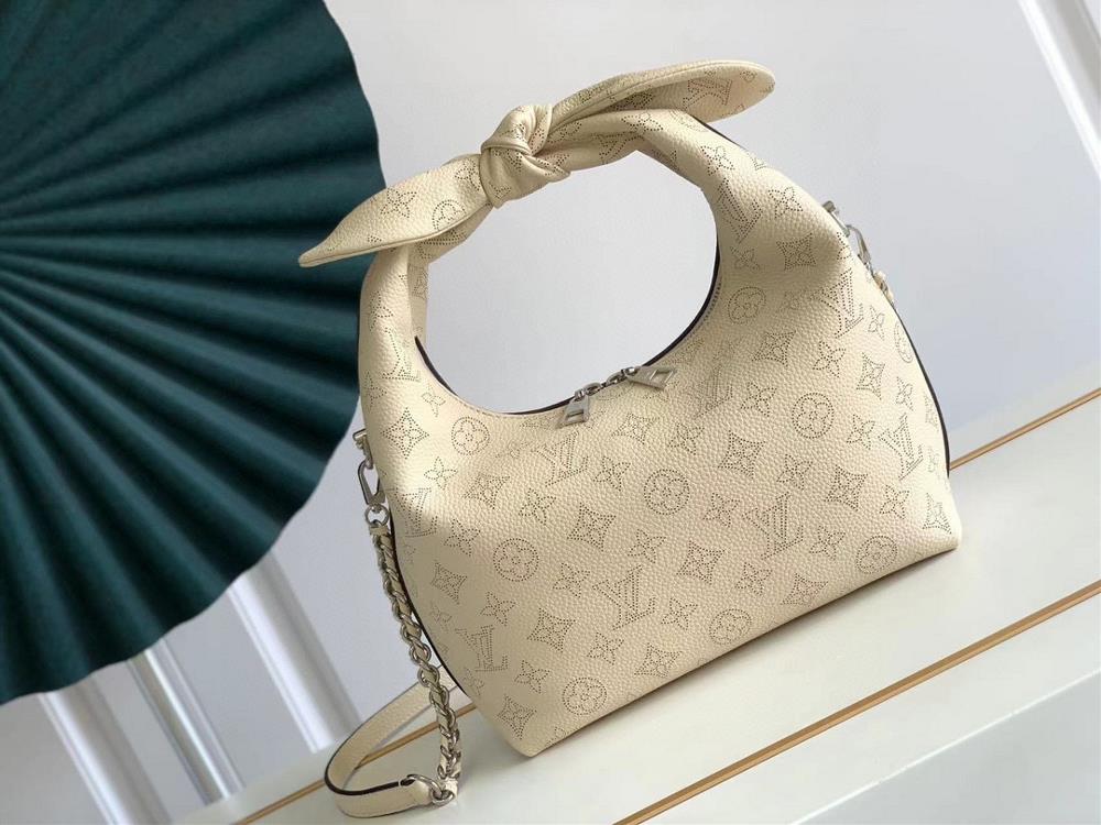 The M20700 M20703 Why Knot small handbag is made of iconic Monogram perforated cowhide leather combined with a knot shaped handle revealing a gentle