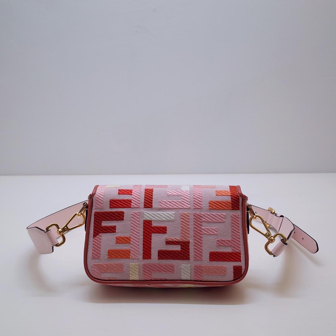 The FEND1 iconic Baguette handbag is made of canvas material and is adorned with red and pink 