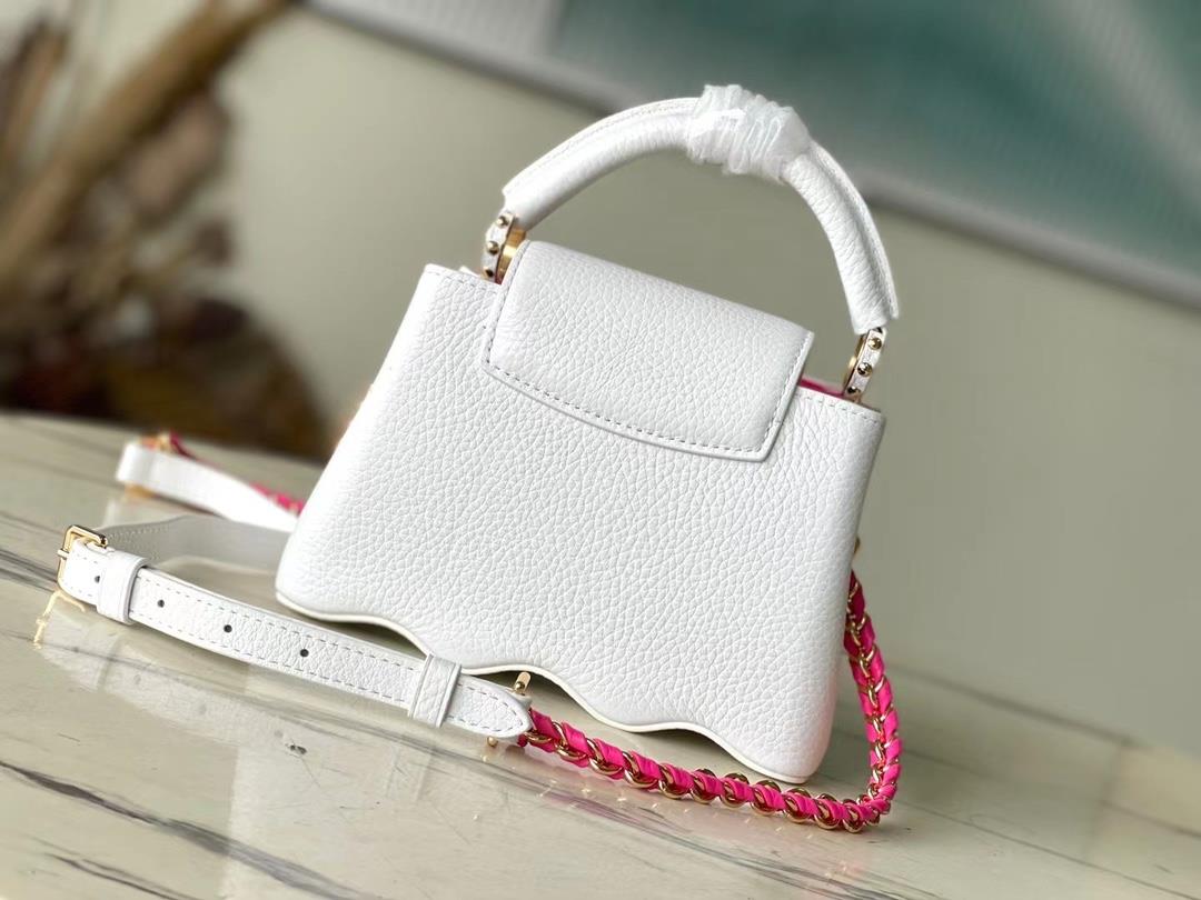 m22121 white mini capushell mini handbag is designed with a new capucines at the bottom of