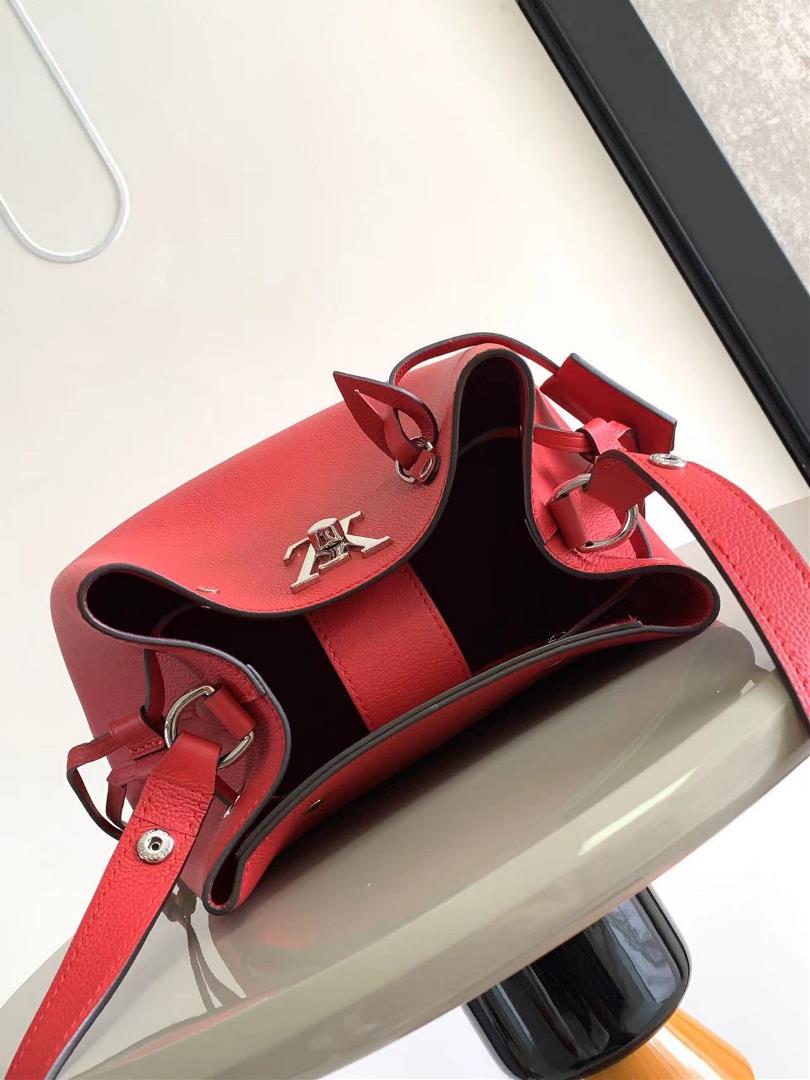 M54677s latest water bucket bag features imported soft calf leather with a shiny twist lo