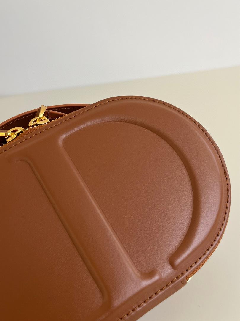 Signature Series Oval Camera BagMeticulously crafted from cow leather the unique letter e