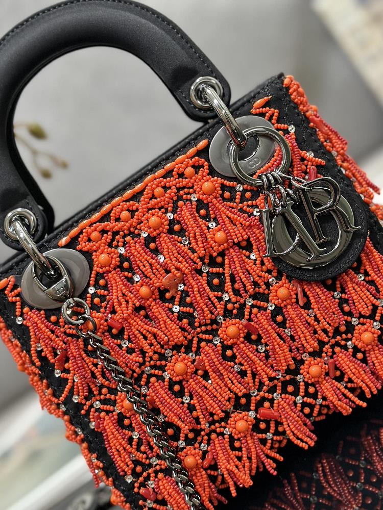 Owning the Dior M0505 Lady Dior bag with the embroidered coral red beads is a true indulge