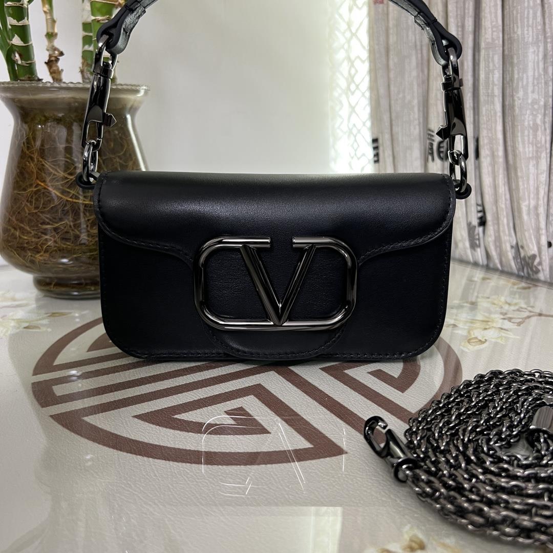 Small Garavani MINI LOC calfskin handbag with metal VLogo Signature detailsEquipped with detachable 