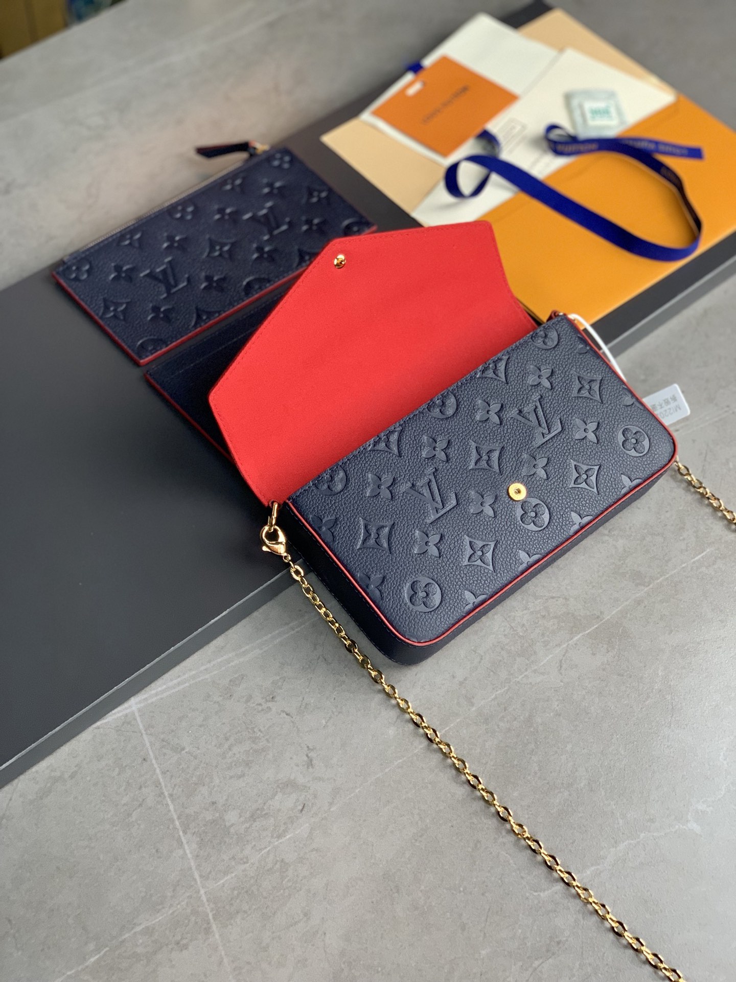 M64064 navy blue The Pochette F  licie Chain Bag is made of Monogram Imprente cowhide fabric a