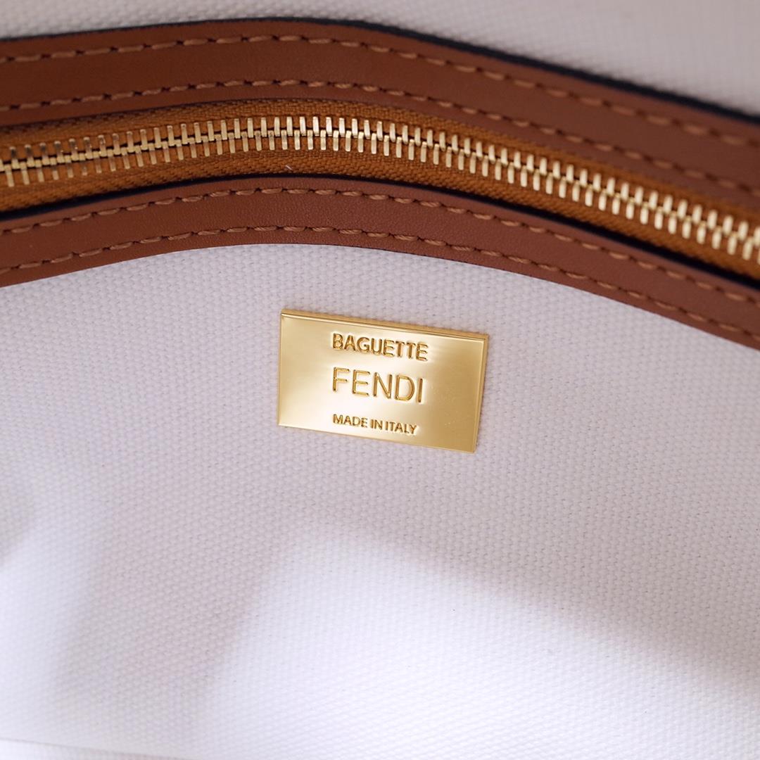 The FEND1 iconic Baguette handbag is made of white canvas material adorned with FF pattern emb