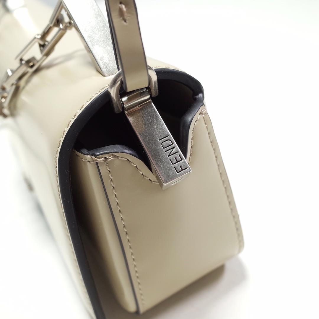 The FENDI handheld bag is made of beige brushed leather material decorated with large F metal 