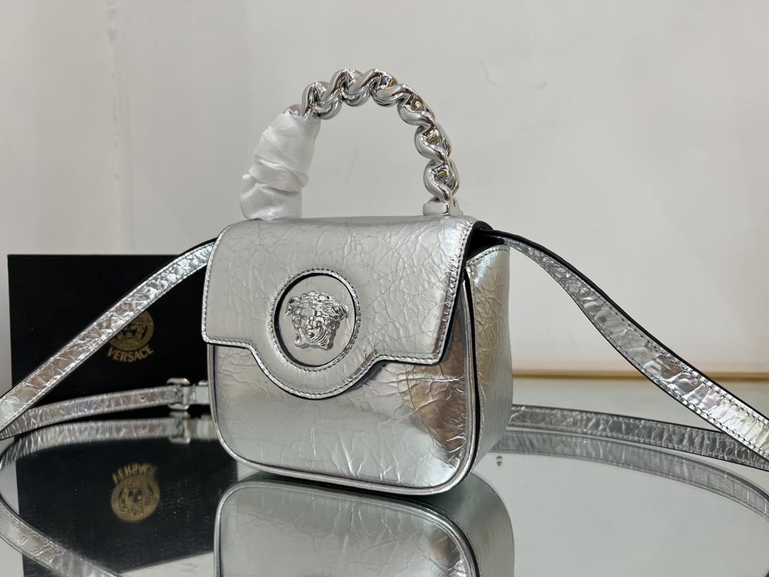 Silver ElephantVERSACE patent leather returns to the Little Queen to pack a modern corner