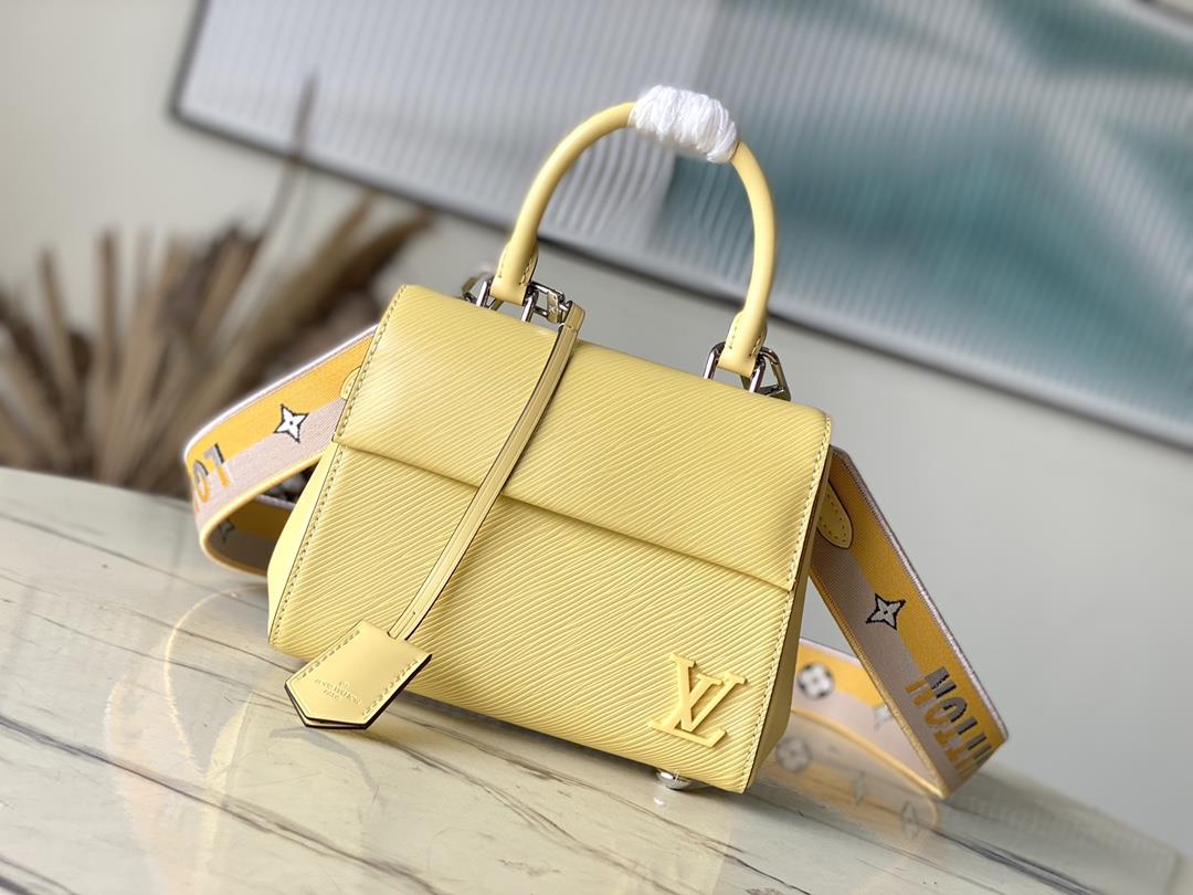 M22616 58931 Chicken YellowThis Cluny mini handbag conveys a fresh summer style with the unique text