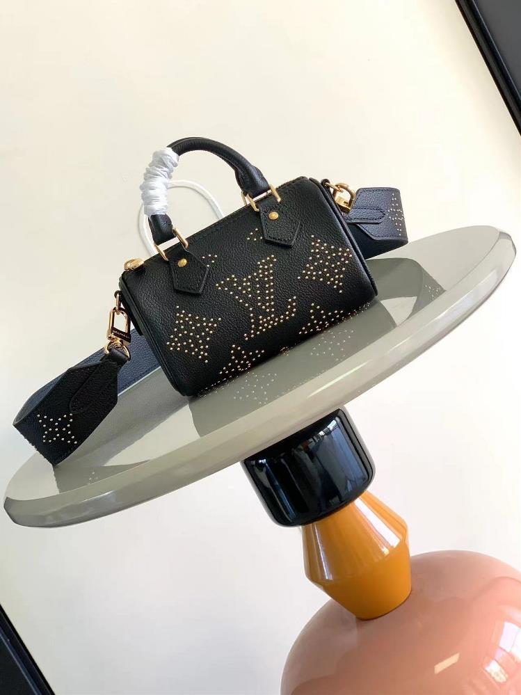 M81625 Black Belt Studs This Nano Speedy handbag is made of grain leather and features eyecatching studs to create Monogram flowers unleashing a lux