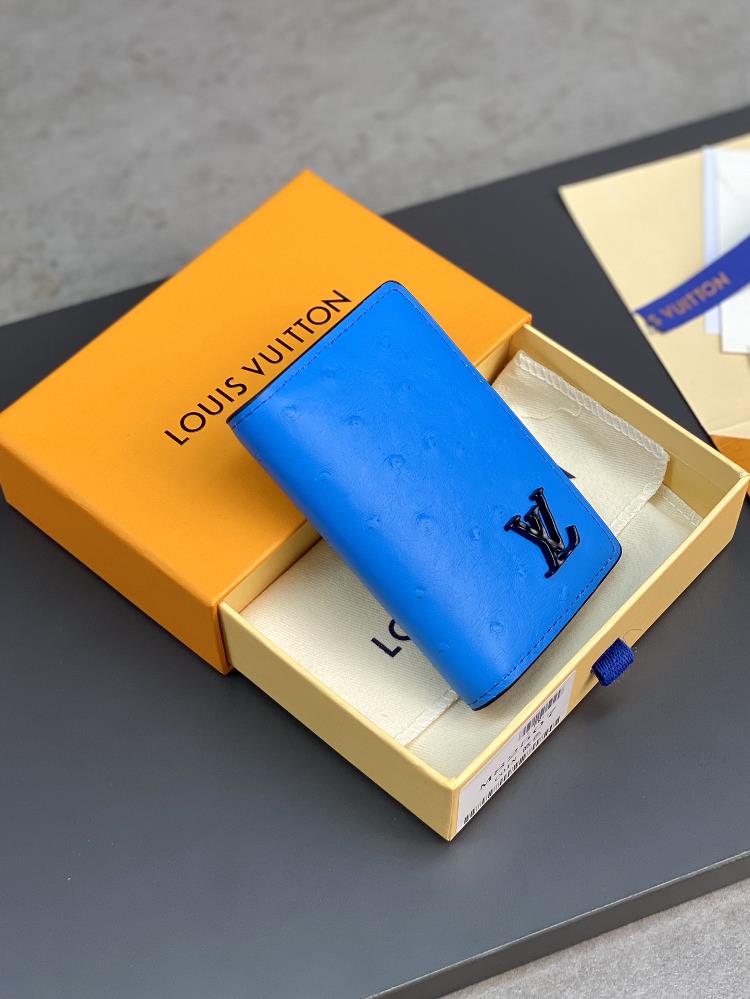 The N82507 Blue Card Bag features a luxurious ostrich leather clip showcasing Louis Vuittons profound expertise in leather making Bright colors inf