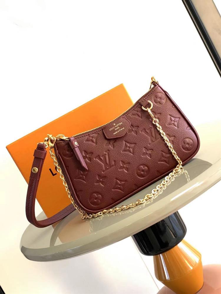 The M80349 M81908 Easy Pouch On Strap handbag is made of Monogram Imprente leather showcasing an ex