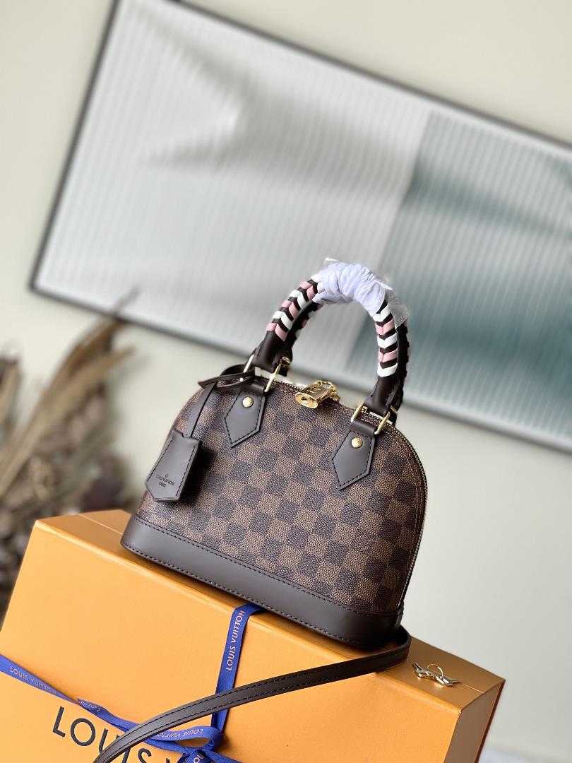 N4044741221 brown plaid weaveThis Alma BB handbag has taken on a new look this season reinterpreting