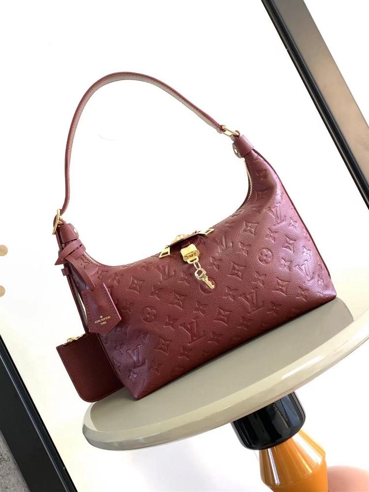 M46610 46609 The Sac Sport handbag is made of soft Monogram Imprente embossed leather with a curved
